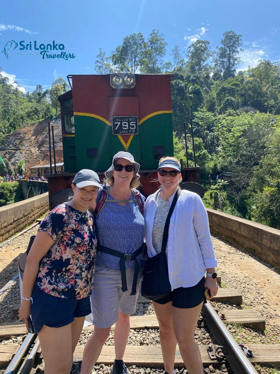 Guests at a hill country train station on a romantic Sri Lanka tour